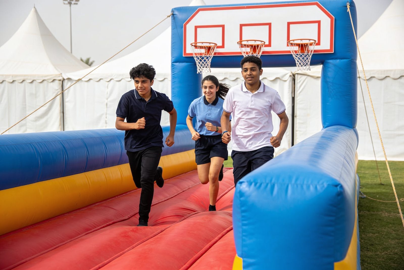 Students trying the bungee run at a Dubai school event