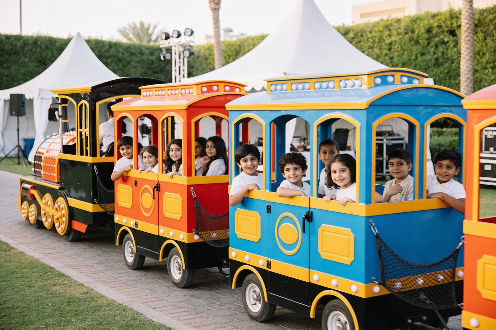 Kids train and carousel ride at a party in Dubai