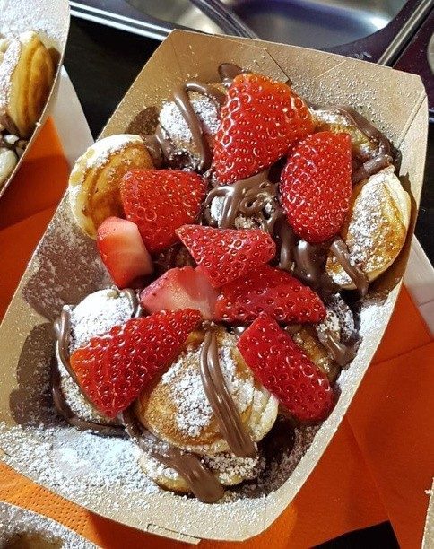 Mini pancakes with strawberries served at a Dubai event