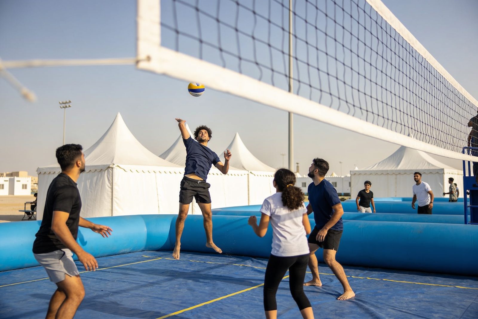 Inflatable volleyball court set up for a Dubai family day