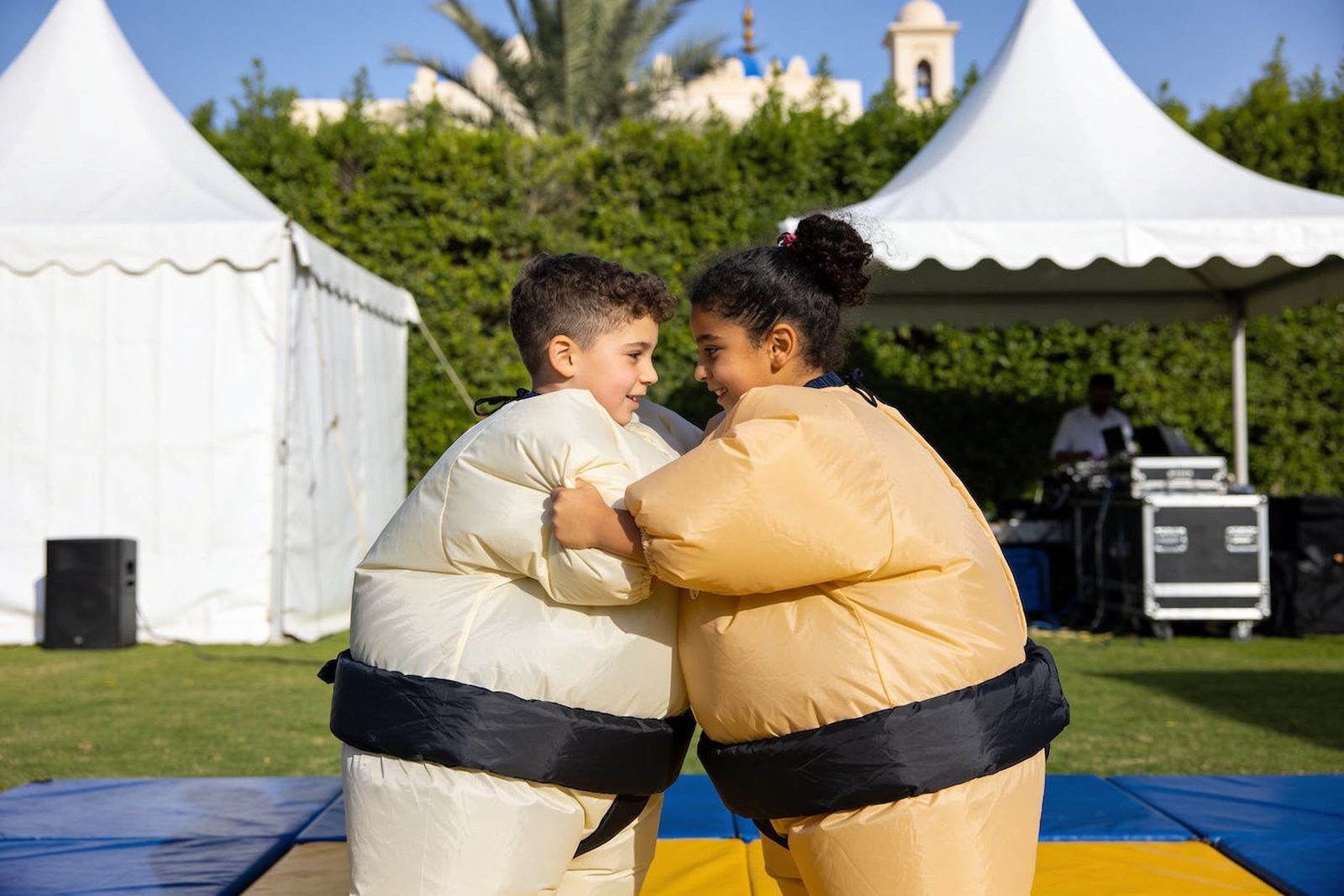 Children wearing sumo suits having fun at a Dubai birthday celebration